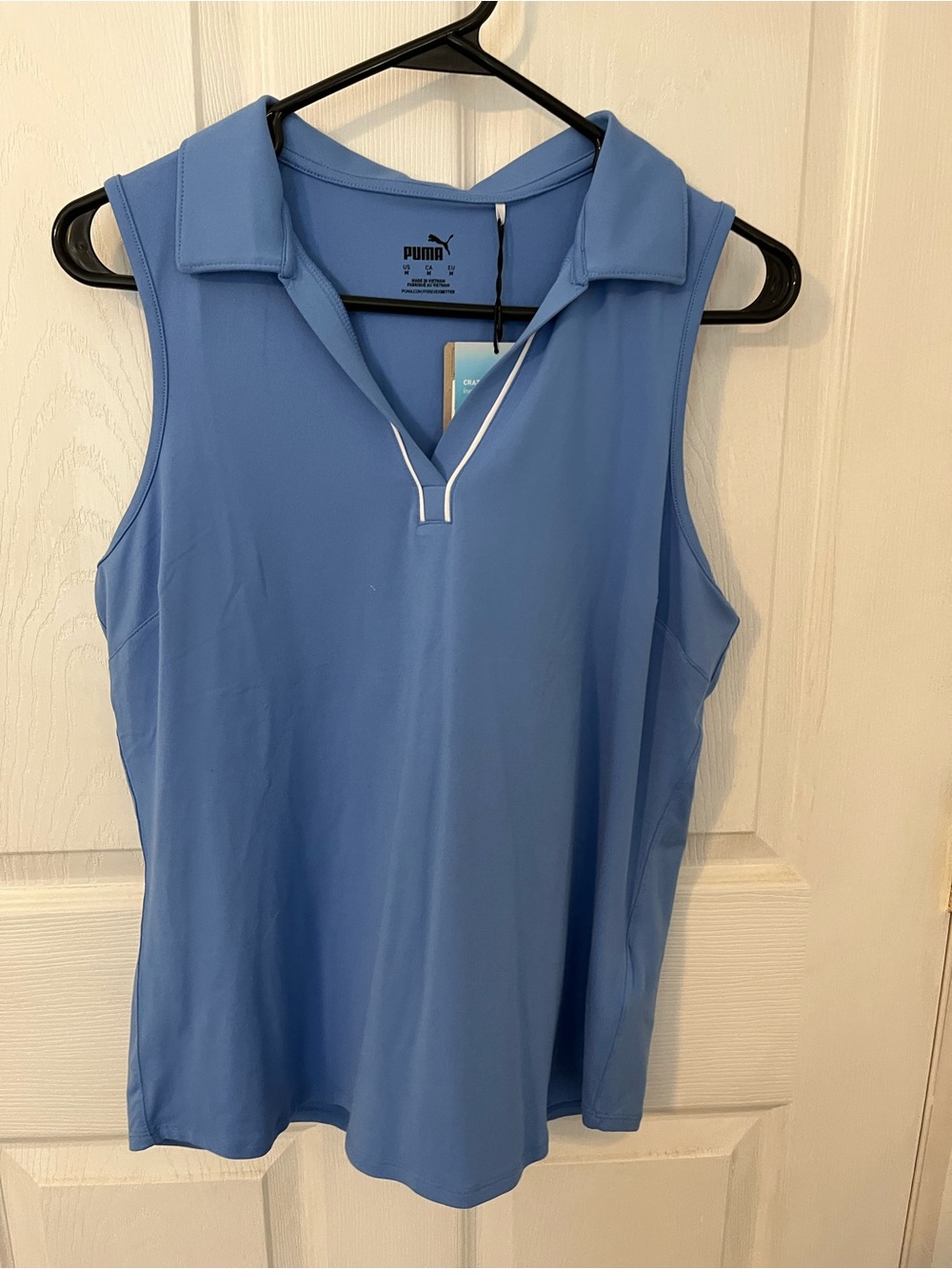 Puma Sleeveless Polo Tank Top in Light Blue with White Trim. Ladies golf shirt